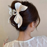 Kukombo French Elegant Pearl Bow Claw Clip Women's Summer Elegance and High Grade Feeling Back Head Spoon Pan Hair Shark Clip Headpiece