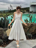 Kukombo 2022 Spring Summer Sexy Backless Waist Bow French Long White Suspender Dress V Neck Beach Style Satin Dress Vacation Style Dress