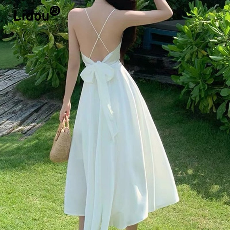 Kukombo 2022 Spring Summer Sexy Backless Waist Bow French Long White Suspender Dress V Neck Beach Style Satin Dress Vacation Style Dress