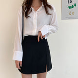 Kukombo  2022 Korean Version Of The Black Split Skirt Loose High Waist Thin Student Solid Bag Hip A-line Short Skirt Casual Preppy Style